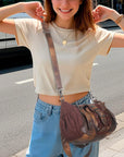 Curved-Panel Studded Buckle Shoulder Tote Bag